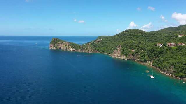 Drone video flying over Soufriere Bay toward Grand Caille Point in Saint Lucia.