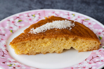 Delicious turkish pastry with syrup revani over a white plate