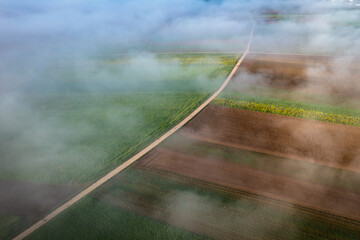 aerial view of fields in the mist