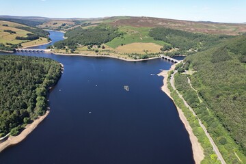 Fototapeta na wymiar Ladybower reservoir Peak District England drone aerial view sunny day summer blue water .