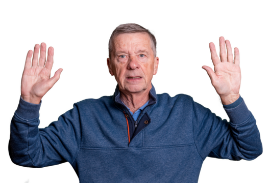 Senior adult male with hands raised and worried expression as he surrenders to his fate - Powered by Adobe
