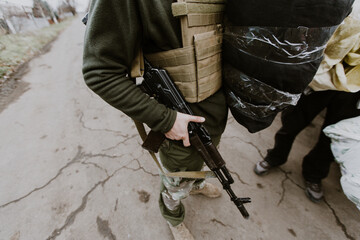 Mariupol, Ukraine - 11.19.2016: Soldier with AK-47. Consequences of the war between Russia and Ukraine.