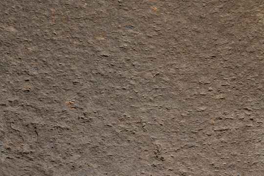 Seamless untreated granite pattern. Gray stone background. The texture of the rock.