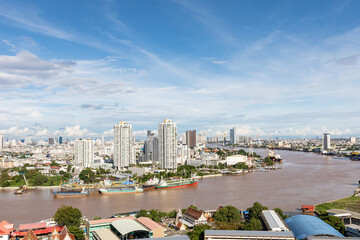 Aerial view Chao Phraya of Bangkok skyline and skyscraper with light trails on Sathorn Road center...