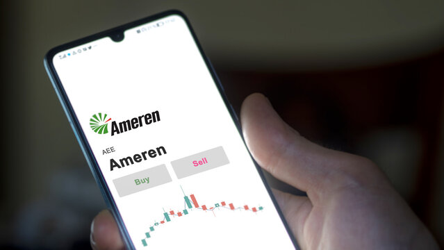 September 13th 2022, New York. An investor's analyzing the Ameren AEE stock on screen. A phone shows the prices to invest
