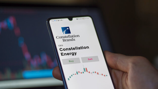 September 13th 2022, New York. An investor's analyzing the Constellation Energy CEG stock on screen. A phone shows the prices to invest