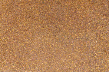 view of the surface strewn with small crystals of natural amber as a natural background