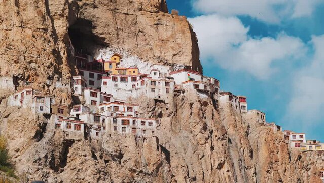 4K shot of Phugtal Monastery made in a natural cave near Purne village in Zanskar, Ladakh India. Ancient monastery made in a cave more than 2550 years ago in India. Monastery built inside the cave. 