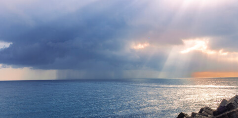 cloud of storm, pouring rain in sea, deep blue cloud speel rain water in ocean , cyclone weathre concept landscape