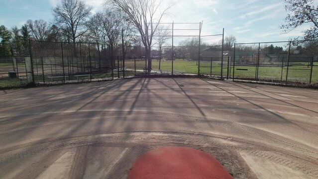Aerial and drone perspective of pitcher's plate on youth's baseball sport field during an autumn day in the fall