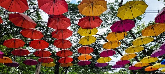 street decorated with colorful umbrella in holambra sky