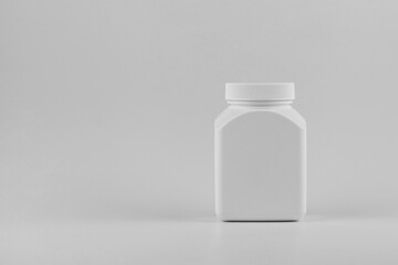pills bottle or pills box or skincare and cosmetology mockup with copy space. Unbranded white plastic flacon for cosmetics products or pills. Branding identity template for text and design