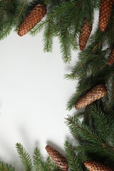 Holidays greeting card or banner composition with pine tree branches. Merry Christmas background and Happy New Year 2023.