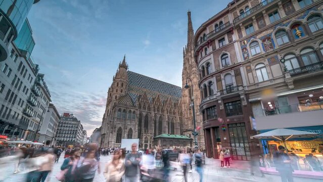 Vienna St. Stephen's Cathedral (Stephansdom) is the mother church of the Roman Catholic Archdiocese of Vienna timelapse, hyperlapse video. People walking on The Stephansplatz square, Austria city.
