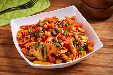 Mixed Pasta Vegetable with peas, cauliflower and olive served in dish isolated on table side view of middle east food