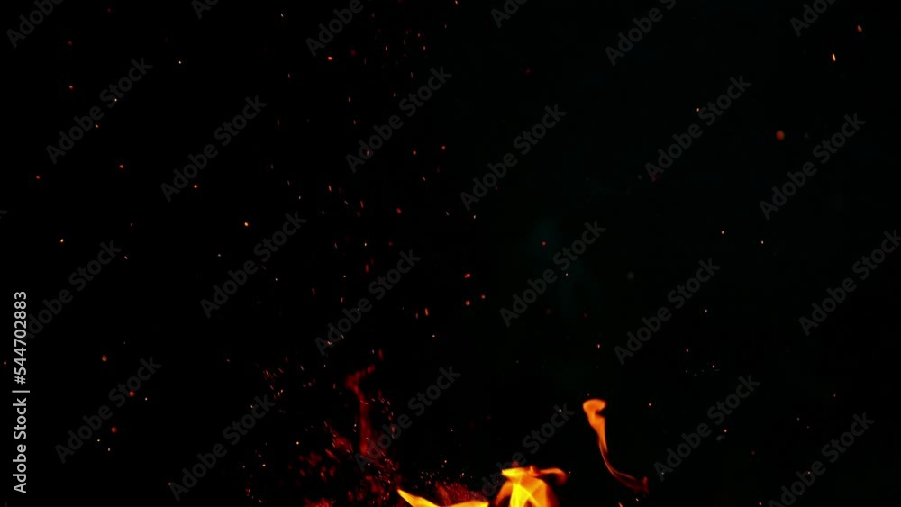 Wall mural Super slow motion of realistic fire sparks isolated on black background. Filmed on high-speed camera, 1000fps.