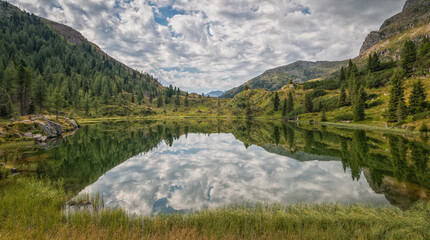 the Colbricon lakes in summer with the mountain reflected on the water - Lagorai chain, Trento...