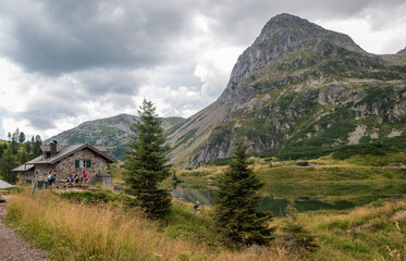 the Colbricon lakes in summer with the little alpine hut near the lakes - Lagorai chain,Trento...