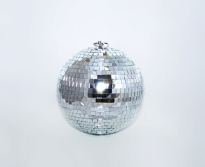 mirror disco ball of silver color on grey
