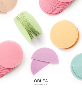 Creative layout made of wafers of different flavours and colours (pink, purple, green, blue, yellow) on the white background. Flat lay. Food concept. A typical sweet of Mexico and Latin America.