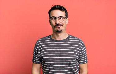 looking goofy and funny with a silly cross-eyed expression, joking and fooling around