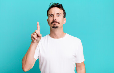 feeling like a genius holding finger proudly up in the air after realizing a great idea, saying...