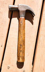 hammer lying on a wooden porch