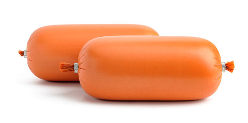 two sticks of boiled sausage in an orange plastic shell on a white background close-up