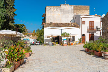 Plaza of Scopello in the north of Sicily. A hamlet of houses clustered around a common courtyard...