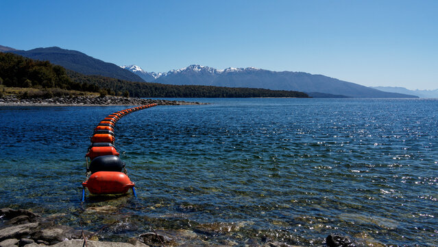 Mussel buoy barrier in front of the Control Gates that control the flow of water between Lake Te Anau and Lake Manapouri. These gates are also at the start of the Kepler Track.