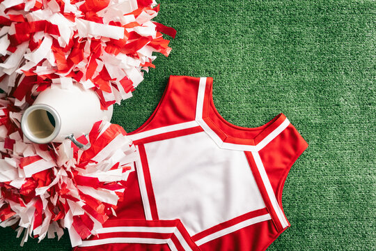 Sports: Cheerleader Uniform with Poms On Field