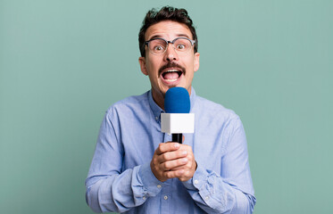 adult man journalist or presenter with a microphone