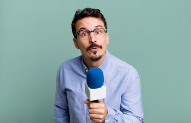 adult man journalist or presenter with a microphone