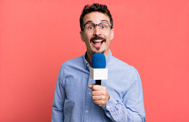 adult man journalist or presenter with a microphone