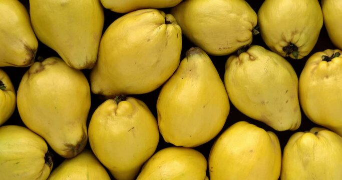 Apple-quince fruits background texture. Table spin.