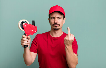 adult man feeling angry, annoyed, rebellious and aggressive. deliveryman packer concept