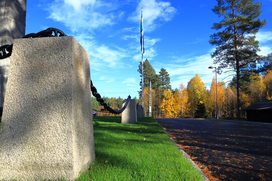 Fence with large metal chain. Part of a peace concept between Sweden and Norway. Autumn day outside. At Eda, V&auml;rmland.