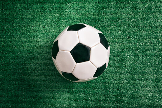 Sports: Soccer Ball On Fake Grass Background