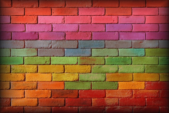 Fototapeta A brick wall painted in a variety of pastel colors. Mur z cegły pomalowany na różne pastelowe kolory.
