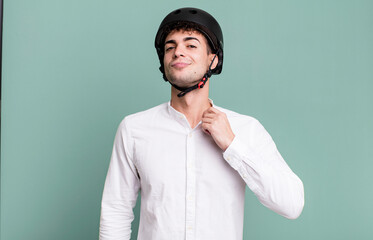 adult man looking arrogant, successful, positive and proud. city motorbike rider concept