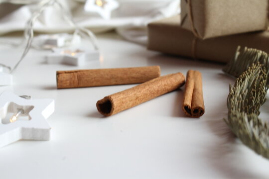 Cinnamon sticks. Happy New Year decoration on plush bedspread with New Year's Eve decoration, concept image, free space for an inscription
