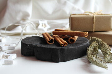 Cinnamon sticks. Happy New Year decoration on plush bedspread with New Year's Eve decoration, concept image, free space for an inscription