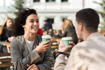 A happy couple outdoors near a cafe