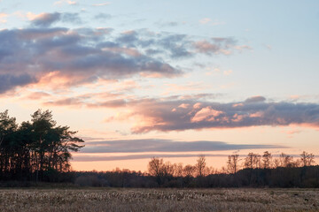 Autumn sunset tree reflection. Sunset sky over river trees. 