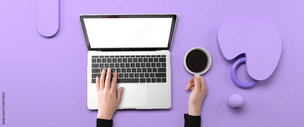 Poster person using a laptop computer with geometric shaped objects from above
