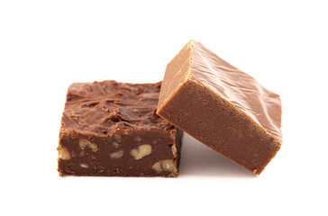 A Piece of Nut and Plain Chocolate Fudge Isolated on a White Background