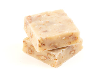 Pieces of Maple Walnut and Pecan Fudge Isolated on a White Background