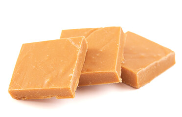 Pieces of Light Brown Fudge Isolated on a White Background