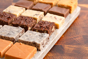 An Assortment of Various Flavors of Fudge on a Wood Butcher Block