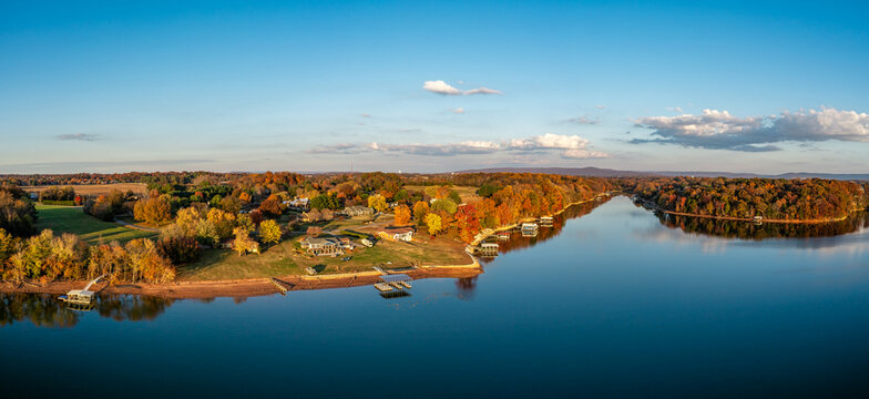 High resolution aerial view panorama of lakefront homes, boat docks and beautiful autumn colorful foliage on Tims Ford Lake in Winchester Tennessee USA.